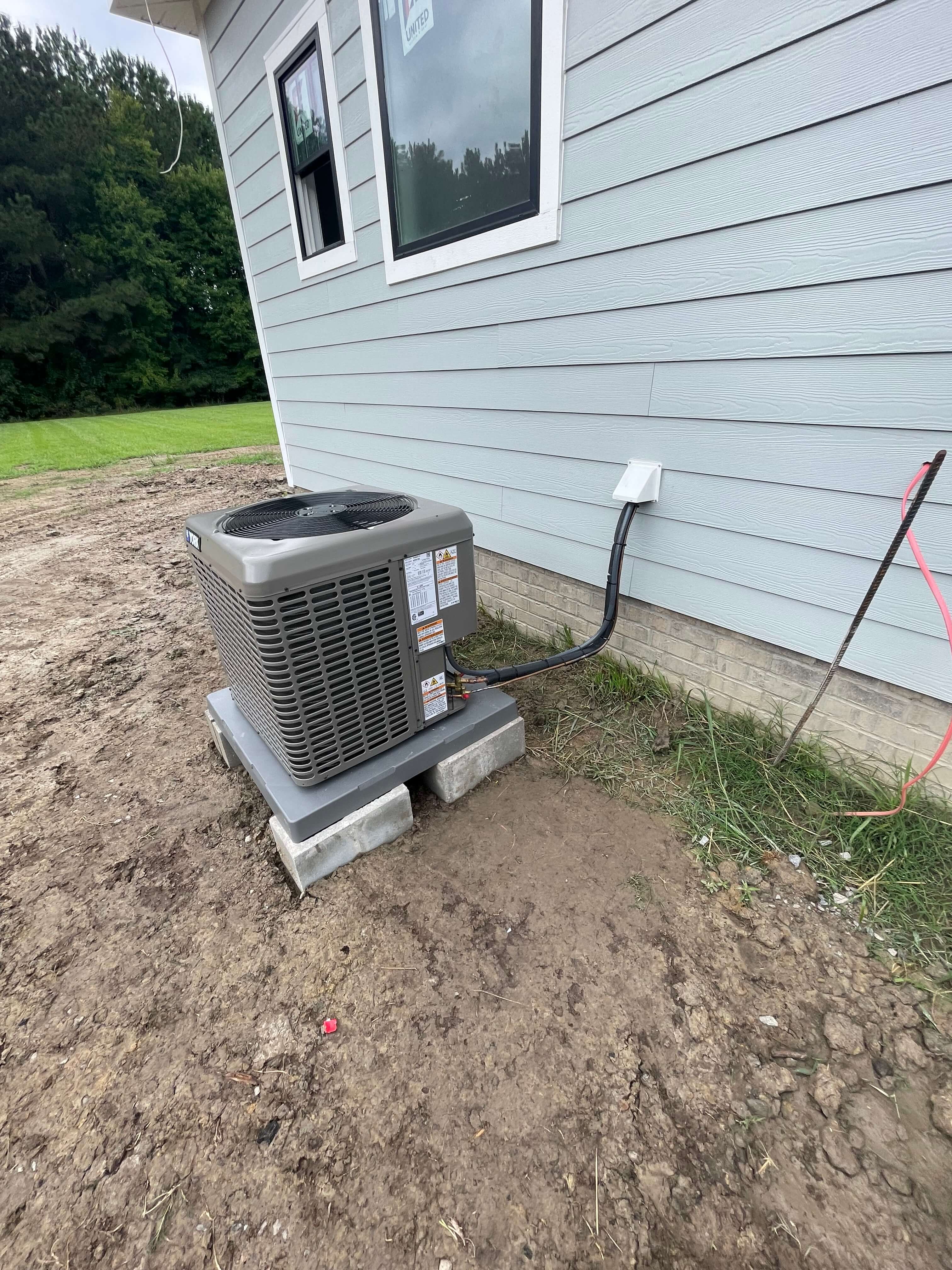 Outdoor heat pump installation by Brawl HVAC